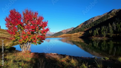 Autumnal mountain lake with vibrant foliage