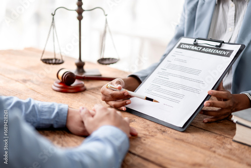 Contract Agreement Legal Advice from Lawyer for Business Deal with Justice Scale. Hand Holding Pen Sign Document Corporate Law Firm Attorney Consulting Service