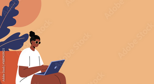Stylish person focused on their laptop, working remotely or studying from a comfortable, modern setting. Ideal for themes of productivity, freelance work, and casual lifestyle.