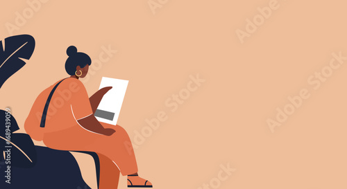Stylish woman focused on reading a document or tablet outdoors, perfect for concepts of learning, remote work, or a relaxed lifestyle.
