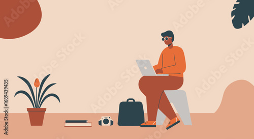 Focused man working on laptop in a comfortable home office setup, representing remote work, freelance, or digital nomad lifestyle.