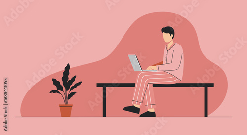 Comfortable man in pajamas works remotely on laptop from home, embodying flexible modern lifestyle, freelance, and online education.