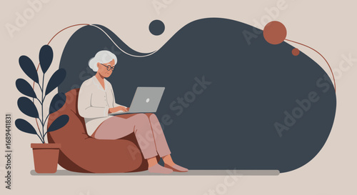 Senior woman comfortably uses a laptop on a beanbag chair at home, highlighting modern digital engagement, remote work, or online learning for older adults.