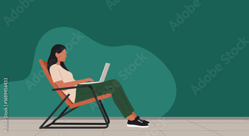 Young woman working remotely on a laptop from a comfortable lounge chair in a modern, minimalist space. Ideal for freelance, home office, or digital nomad concepts.