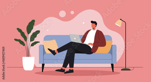 Young man focused on his laptop while relaxing on a comfortable couch at home, perfect for remote work, online learning, or digital lifestyle concepts.