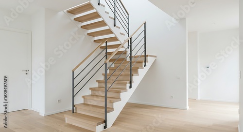 Modern wooden staircase in a bright new house interior.