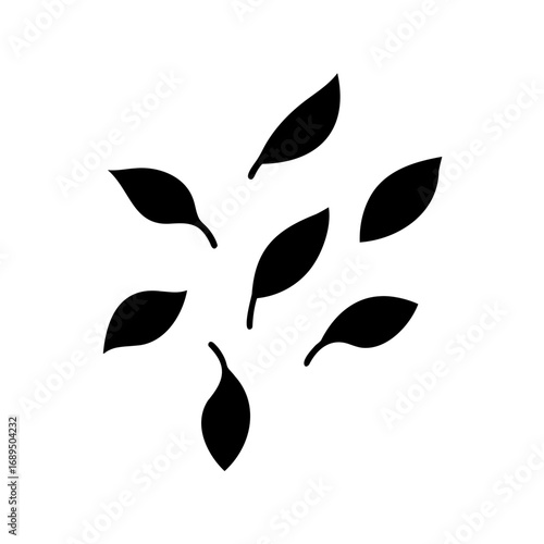 A scattered assortment of dark leaves on a stark white background artfully arranged