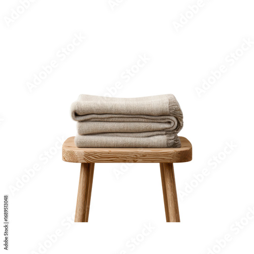 Folded Beige Knit Throw Blanket on Wooden Stool