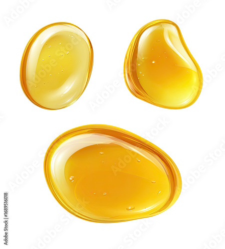 Three glossy, golden-yellow liquid drops, shaped like smooth, slightly irregular stones