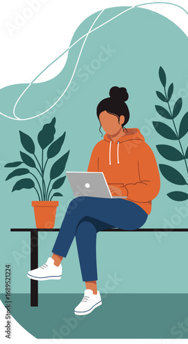 Young woman working on her laptop in a modern, plant-filled environment. Depicts remote work, flexible lifestyle, and digital productivity.