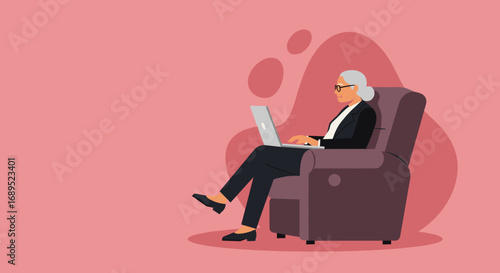 Elderly businesswoman focused on her laptop while comfortably seated in an armchair. Depicts modern senior using technology for work or learning, highlighting digital literacy and remote productivity.