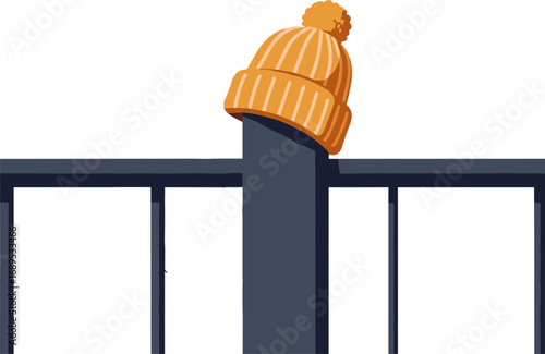 Orange knitted hat perched on a black metal fence post  