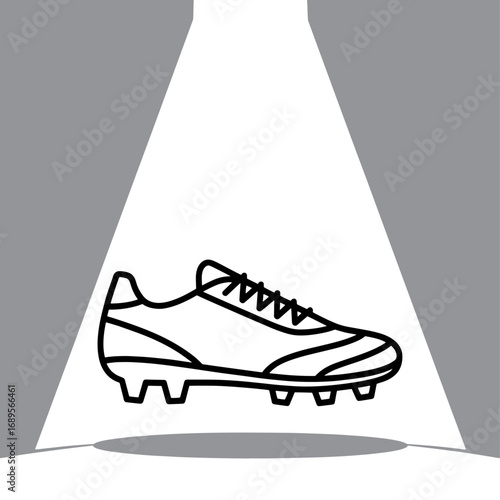 Spotlit Football Boot a Symbol of Athletic Prowess and Sporting Goods Excellence in Dynamic Black and White