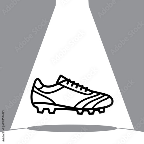 Spotlit Football Boot a Symbol of Athletic Prowess and Sporting Goods Excellence in Dynamic Black and White