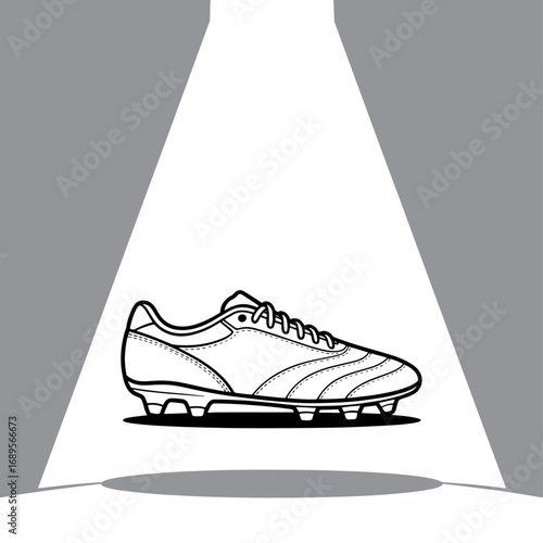Spotlit Football Boot a Symbol of Athletic Prowess and Sporting Goods Excellence in Dynamic Black and White