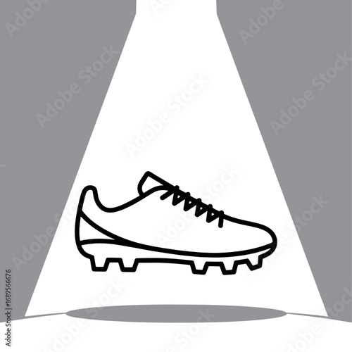 Spotlit Football Boot a Symbol of Athletic Prowess and Sporting Goods Excellence in Dynamic Black and White