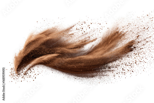 Brown powder exploding in a swirling motion against a black background.  Particles of the powder are dispersed in a dynamic, flowing pattern