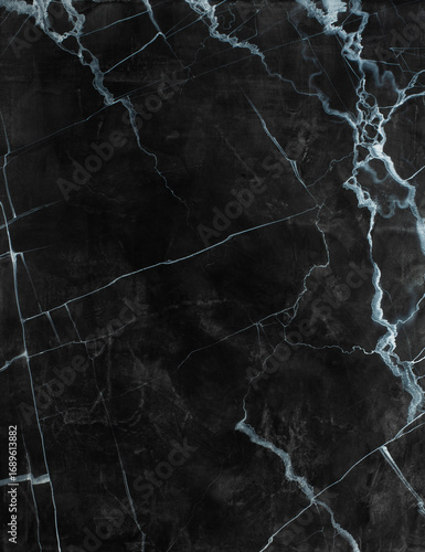 Dark marble texture with intricate white veining, showcasing natural stone patterns, ideal for backgrounds, design projects, and artistic applications in modern aesthetics