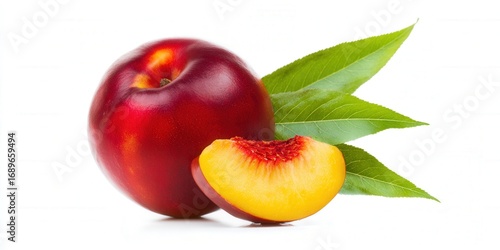A close-up of a nectarine fruit with a slice, and green leaves on a white background.