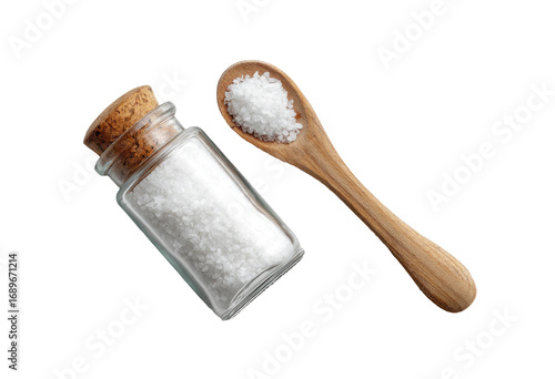 Small glass jar and wooden spoon filled with coarse sea salt