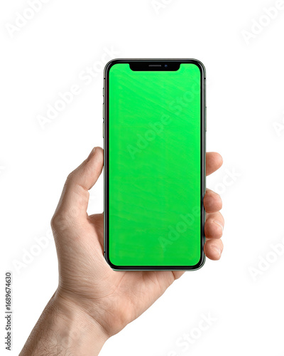 A hand holding a smartphone with a green screen