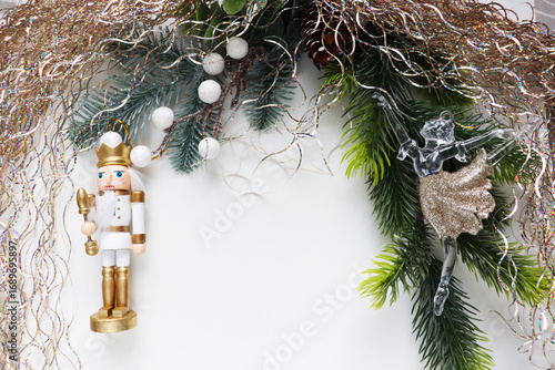 christmas card for children. ballerina and nutcracker figurine on christmas tree	