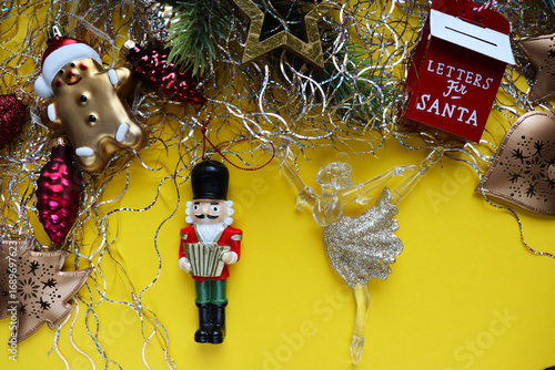 christmas card for children. ballerina and nutcracker figurine on christmas tree	