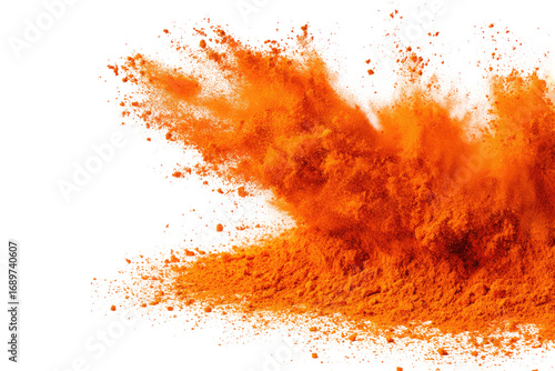 Explosive orange powder explosion against a black background