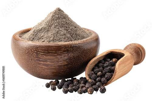 Ground peppercorn in wooden bowl and scoop