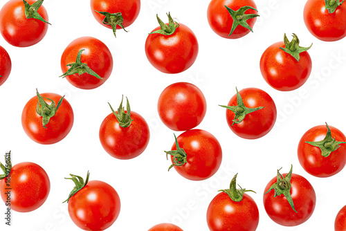 Red cherry tomatoes scattered on a black background