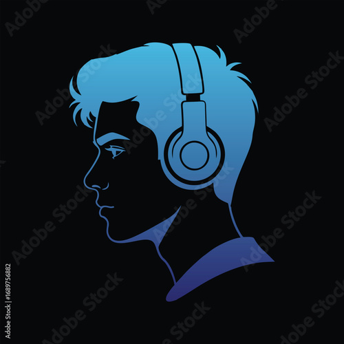 A young man wearing headphones is listening to music on a dark background.
