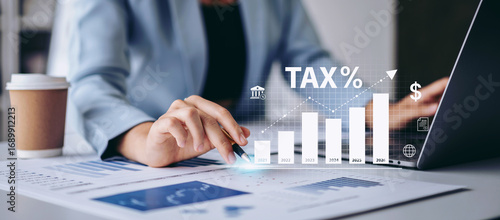 Calculation tax return and VAT concept, Businesswoman pointing tax icon for calculates fill out personal income to pay taxes return form online for tax payment, interest rate with tax and percentage