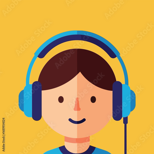 Boy listening to music with blue headphones against a yellow backdrop, enjoying the sound and rhythm in a cheerful mood.