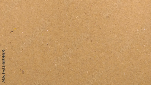 Background of brown kraft paper or cardboard texture, Abstract pattern of beige rough carton, old paper sheet, parchment or papyrus surface.