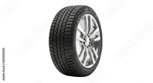 New black modern winter car tire with detailed directional tread and deep sipes, on polished silver multi-spoke alloy wheel, against transparent studio background with soft cast shadow. Concept of