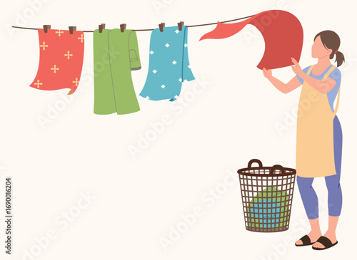 A woman is drying clothes.