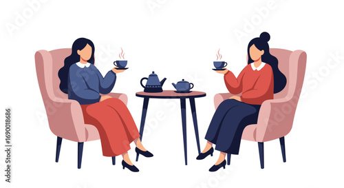 Two women enjoying hot tea in a cozy cafe while sitting in comfortable armchairs at a small table