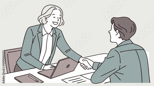 Business people shaking hands at meeting laptop on desk agreement deal partnership success.