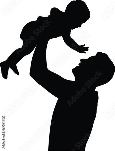 Father lifts baby in silhouette lifting playing