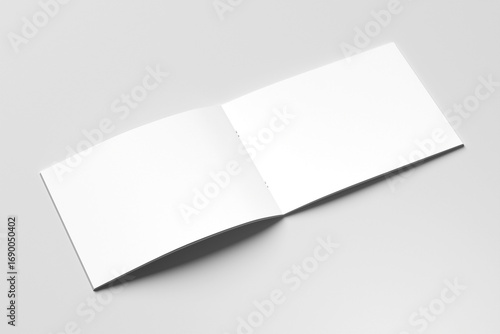 Landscape blank mockup of an open book, magazine, brochure or booklet isolated on a light grey background