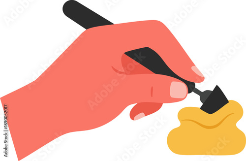 Creative hand holding brush dipping into yellow paint or substance
