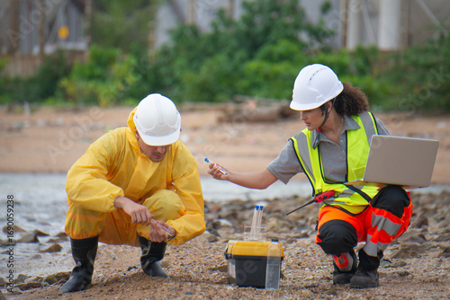 Scientists and assistants are collecting water samples from natural sources to analyze contaminants from water discharged from industrial plants.