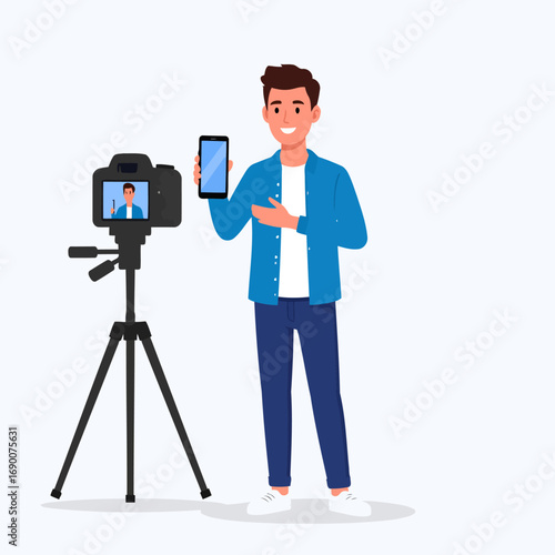 Young man filming a video review of a smartphone on a tripod.