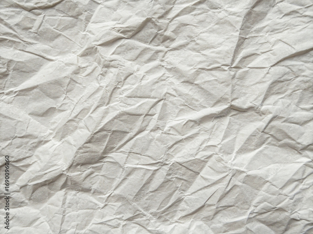 Obraz premium White Crumpled Paper Texture with Folds and Wrinkles