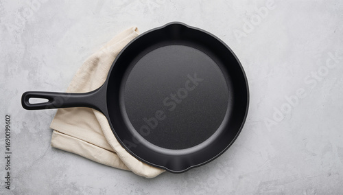 Black cast iron skillet with cloth cooking kitchen