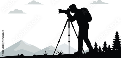 Silhouette of Nature Photographer with Camera on Tripod in Mountains