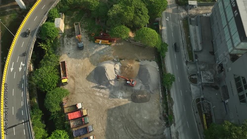 Aerial View of Highway Interchange Surrounded by Vegetation and Construction Sites in July