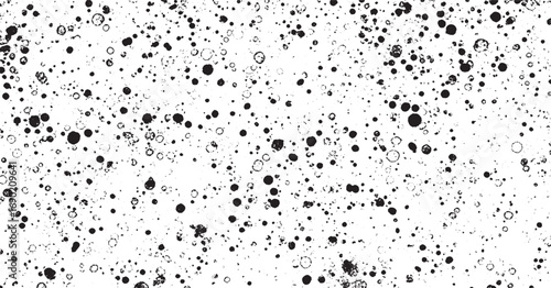 Abstract black and white speckled dotted pattern with playful organic texture