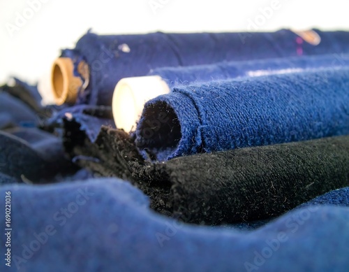 Rolled-up fabric in shades of blue and black