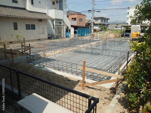 A scene from the construction of a new detached house and foundation work (from leveling the ground to assembling the rebar) / 一戸建て住宅の新築・基礎工事の光景(整地～基礎配筋 - 鉄筋の組み上げ)